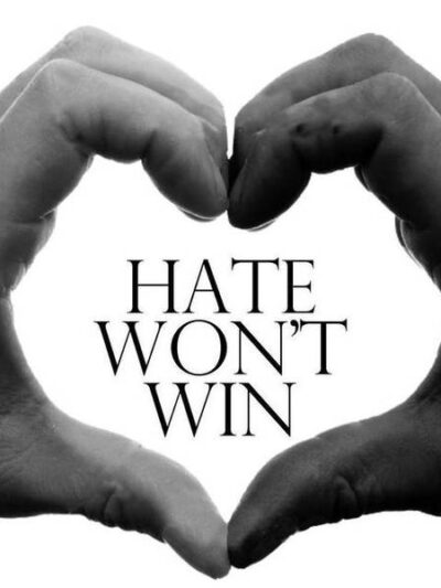 Text: Hate Won't Win with white hand & black hand forming a hard around the words