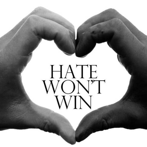Text: Hate Won't Win with white hand & black hand forming a hard around the words