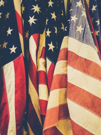 several american flags standing together