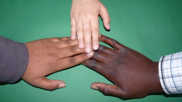 Multi-cultural races hands coming together