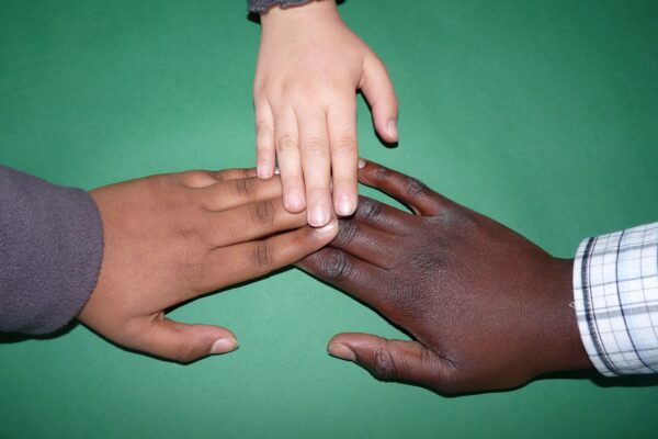 Multi-cultural races hands coming together