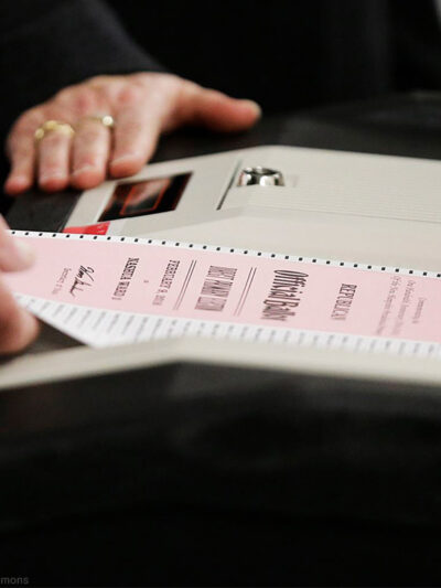 A ballot is entered into a machine at a polling site
