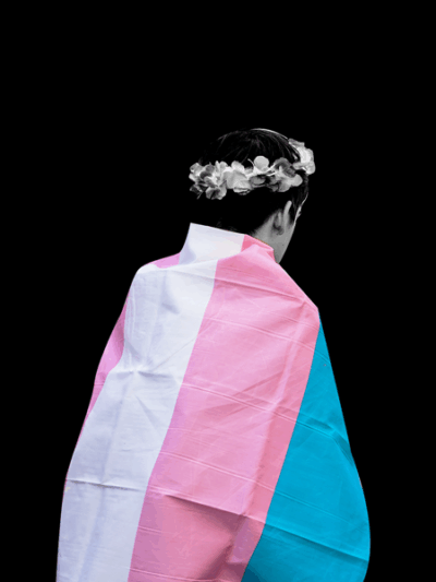 youth wearing a transgender flag
