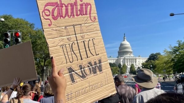 Rally sign, abortion justice now.jpeg