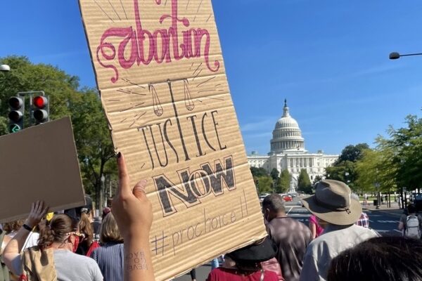 Rally sign, abortion justice now.jpeg