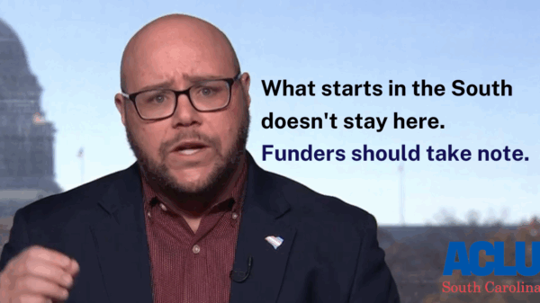 "What starts in the South doesn't stay here. Funders should take note." Photo of Executive Director Jace Woodrum, a white man with short facial hair and thick rimmed glasses, speaking in front of the U.S. Capitol. The ACLU-SC logo is at bottom right.