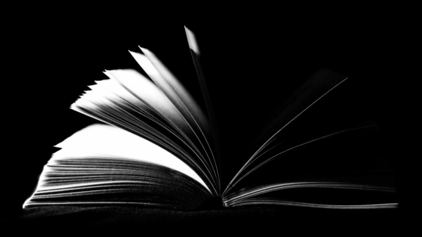 Black and white image of an open book.