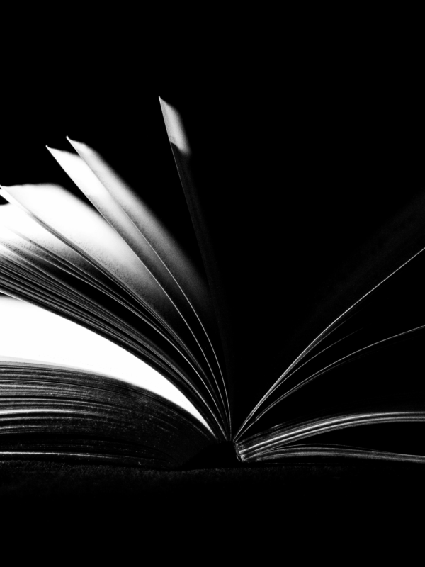 Black and white image of an open book.