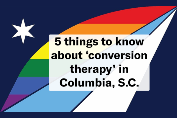"5 things to know about 'conversion therapy' in Columbia, S.C." Text overlaid on the official Columbia city flag with a pride rainbow color theme.
