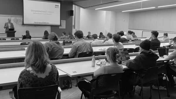 A speaker addresses a classroom of law students