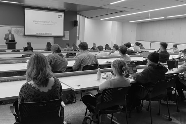 A speaker addresses a classroom of law students