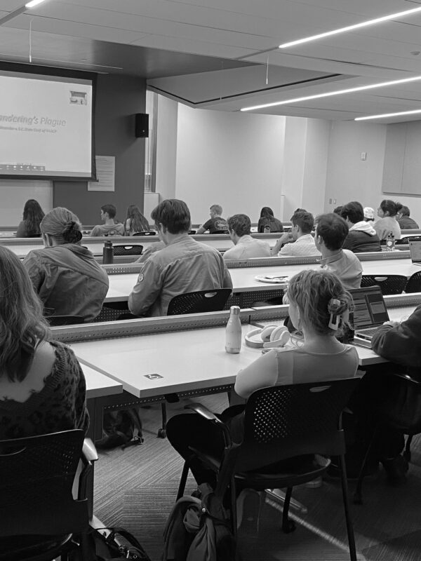 A speaker addresses a classroom of law students