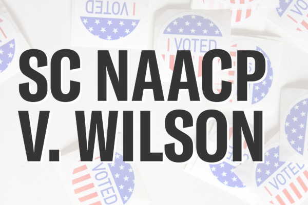 "SC NAACP v. Wilson." Background photo of "I Voted" stickers in red, white, and blue.