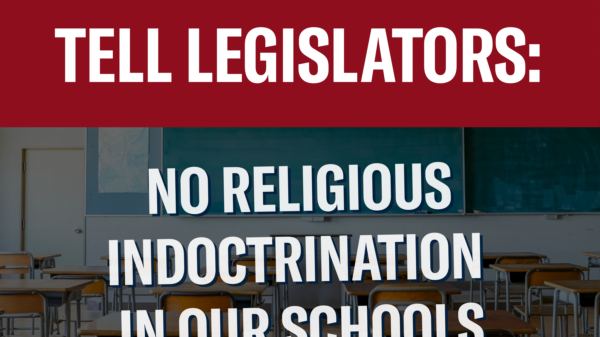 Tell Legislators: No religious indoctrination in our schools. Background photo of a classroom.