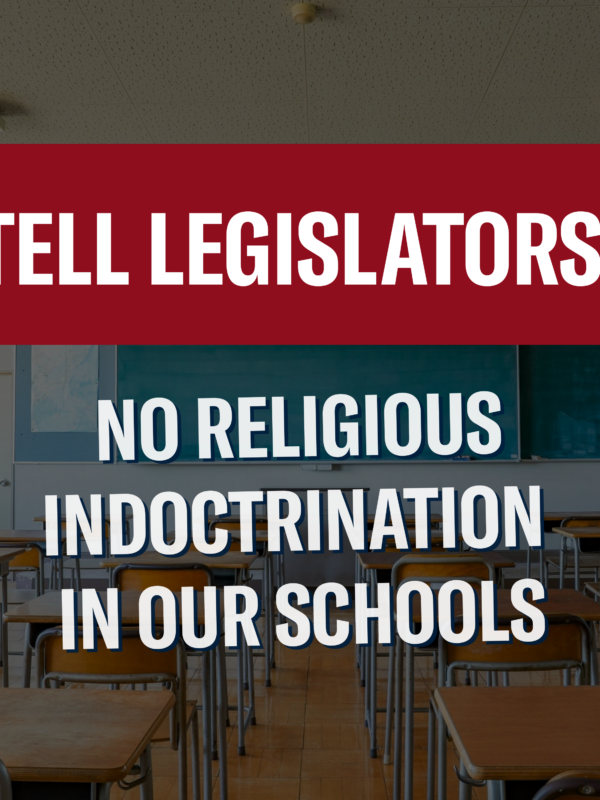 Tell Legislators: No religious indoctrination in our schools. Background photo of a classroom.