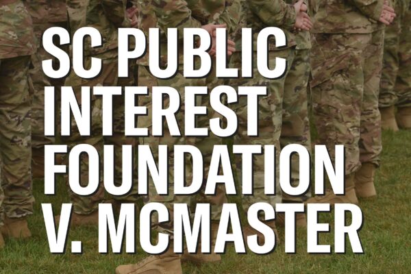 "SC Public Interest Foundation v. McMaster." Background photo of people wearing military fatigues on green grass.