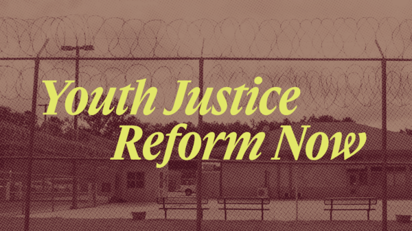 Image of barbed wire fence with benches behind it. Text reads "Youth Justice Reform Now"