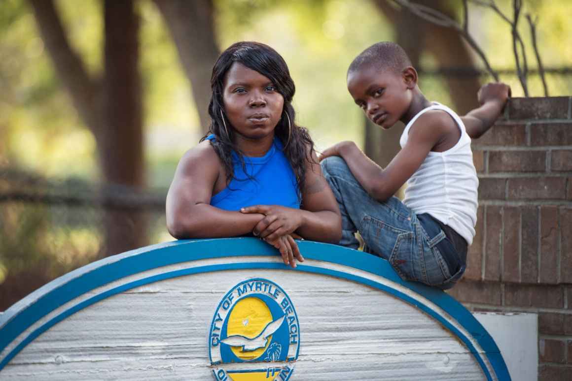 Plaintiff Cayeshia Johnson with her son at the playground