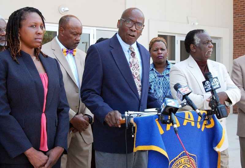 Civil rights leaders at speaking at press conference