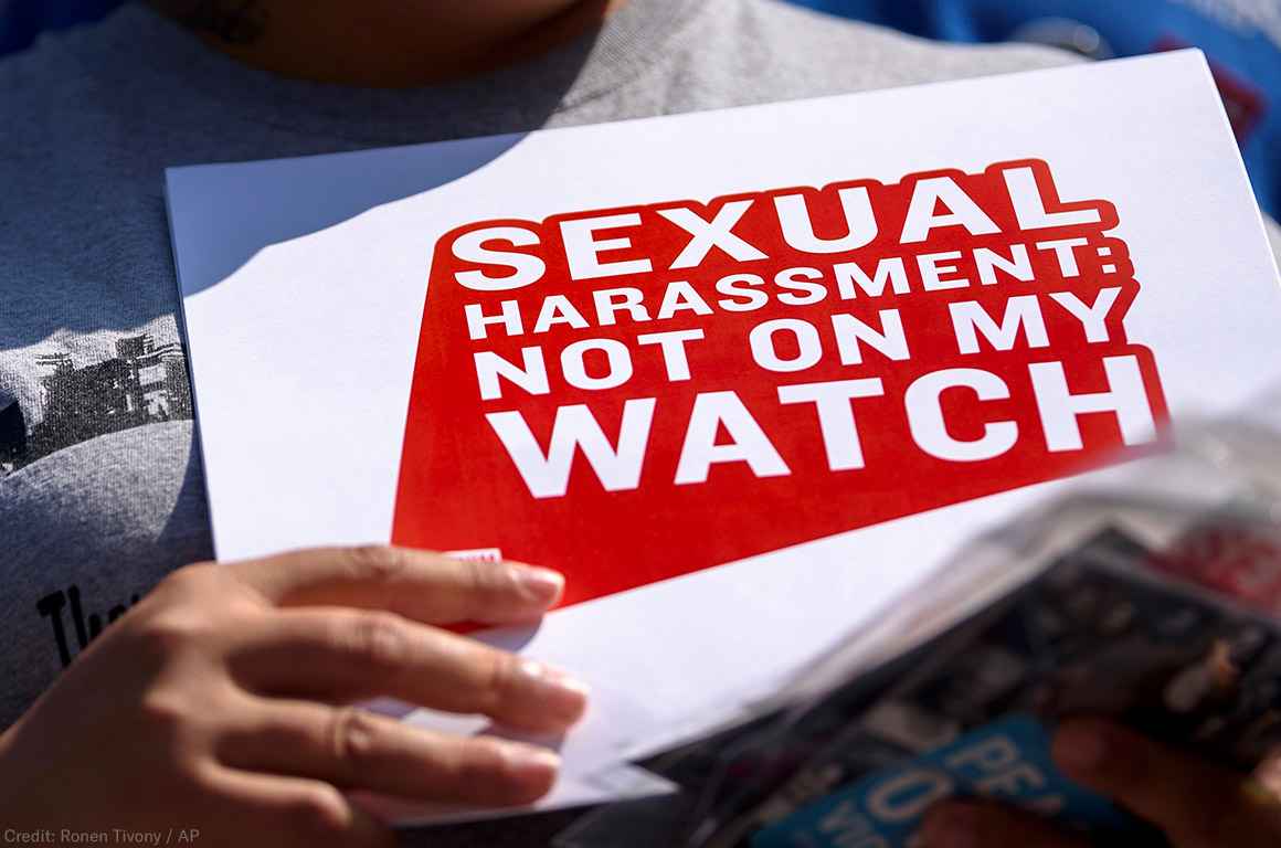 Protester holding sign stating &quot;Sexual Harassment: Not on my Watch