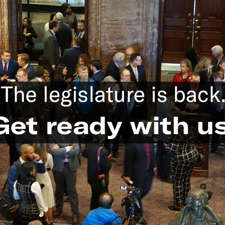 "The legislature is back. Get ready with us." Text is overlaid on an aerial-view photo of people milling around in the State House lobby.