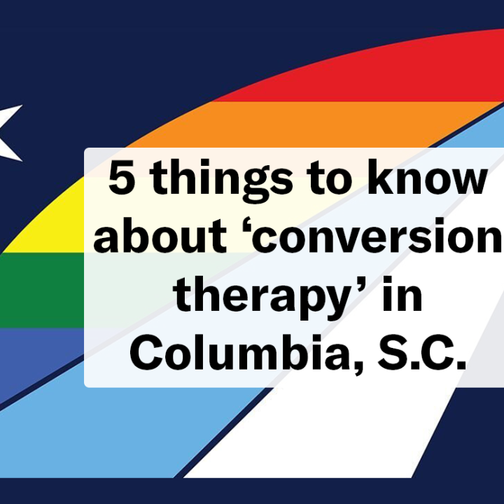 "5 things to know about 'conversion therapy' in Columbia, S.C." Text overlaid on the official Columbia city flag with a pride rainbow color theme.